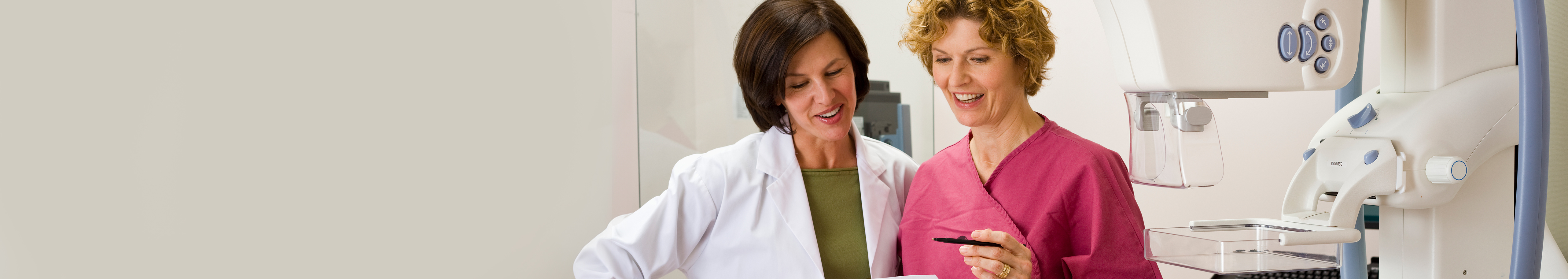 Two health care professionals in a radiology lab.