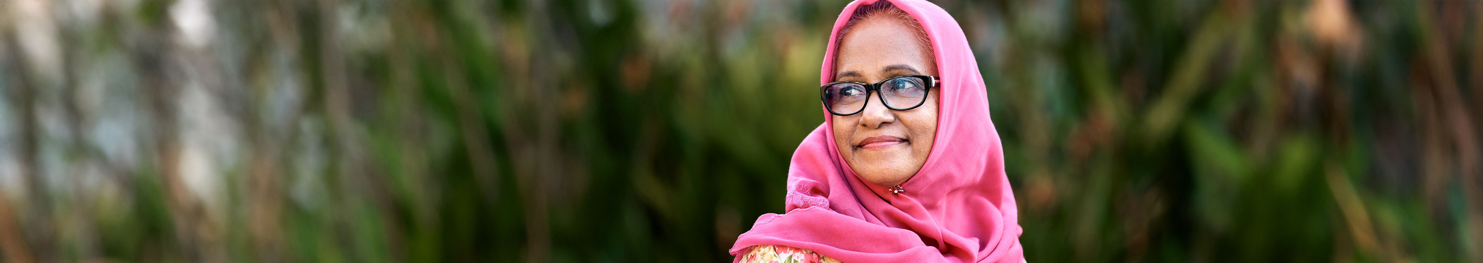 Multicultural women with a pink scarf covering her head